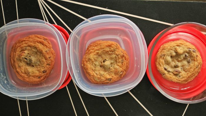 Three cookies stored in different containers.
