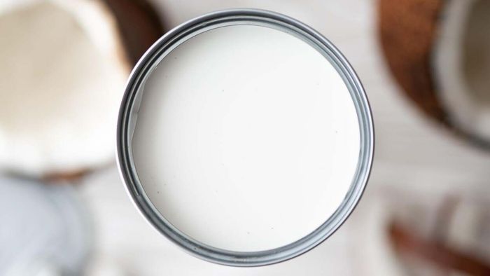 A can of opened coconut milk.