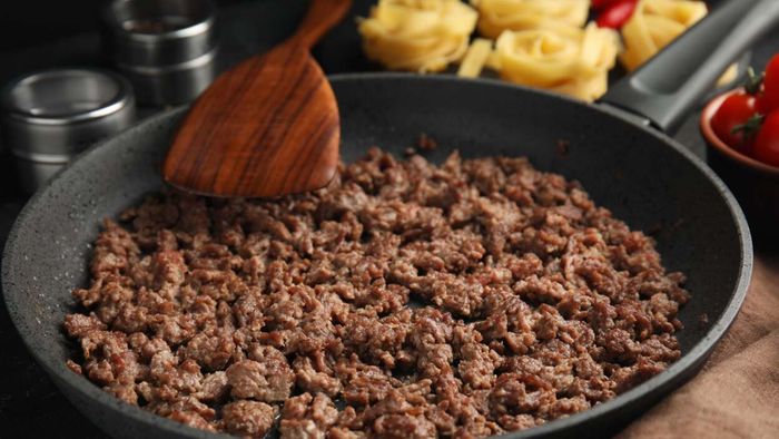 A close-up shot of a skillet with browned ground meat.