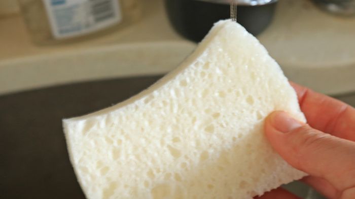 Water dripping onto a dish sponge.