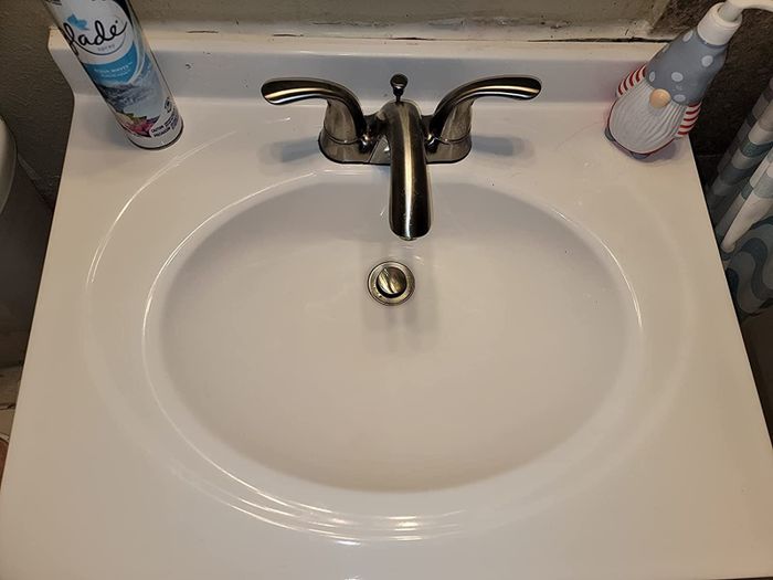 A reviewer's 'after' photo showcasing a perfectly cleaned sink, free of stains.