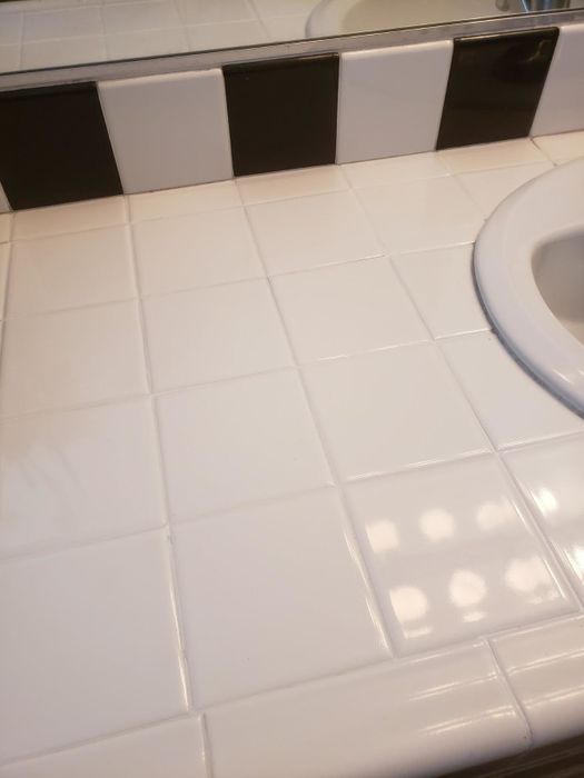 the same white tile counter now looking fresh, clean, and as good as new