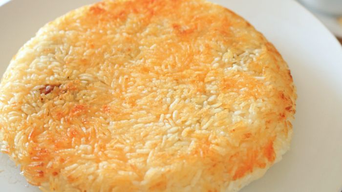 Toasted fried rice cake placed on a plate.