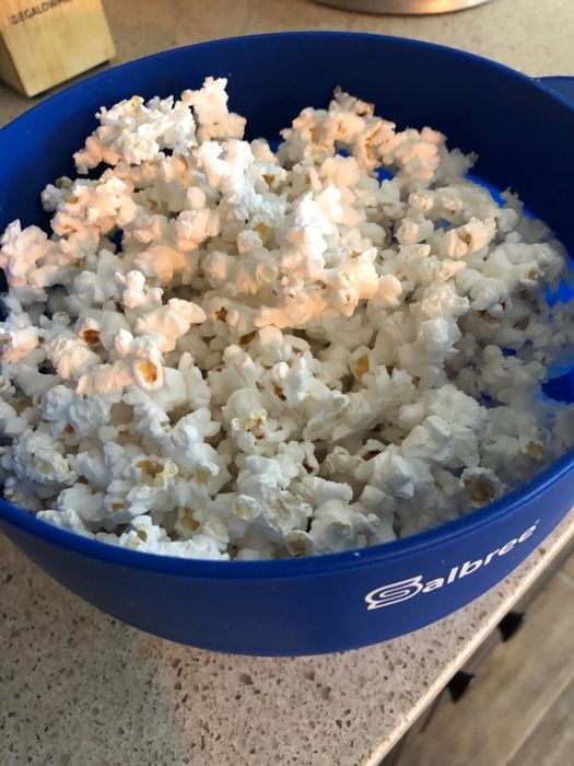 The same popcorn kernels, now popped in the bowl.