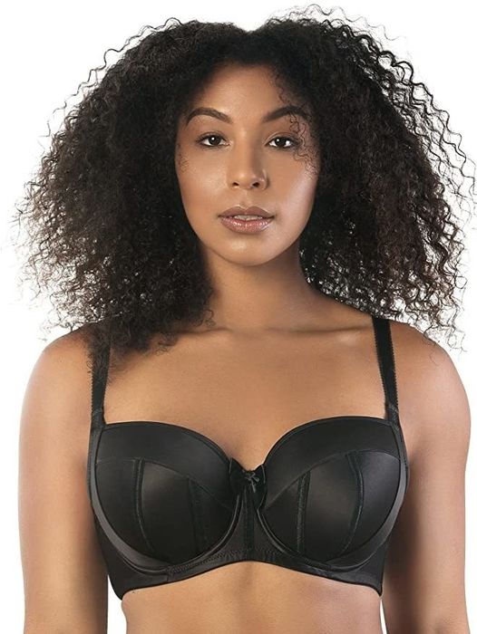 A model showcasing a black balconette bra.