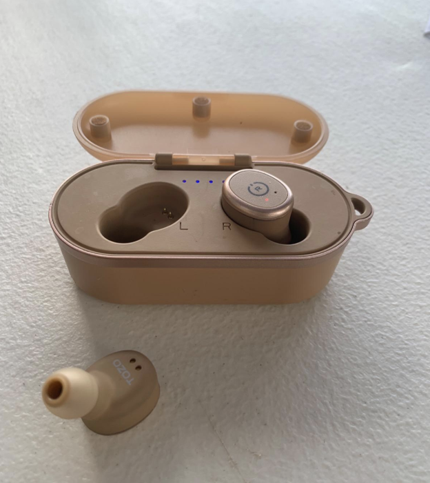 A pair of wireless earbuds in a sleek rose gold color.