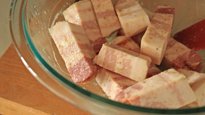 Close-up of pork chunks in a bowl.