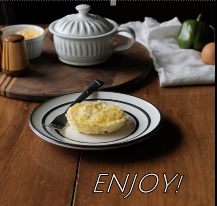 A perfectly cooked mini omelette placed on a plate.