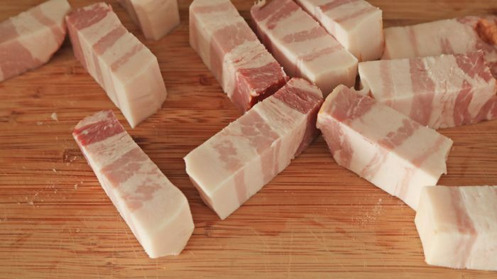Raw slices of pork belly.