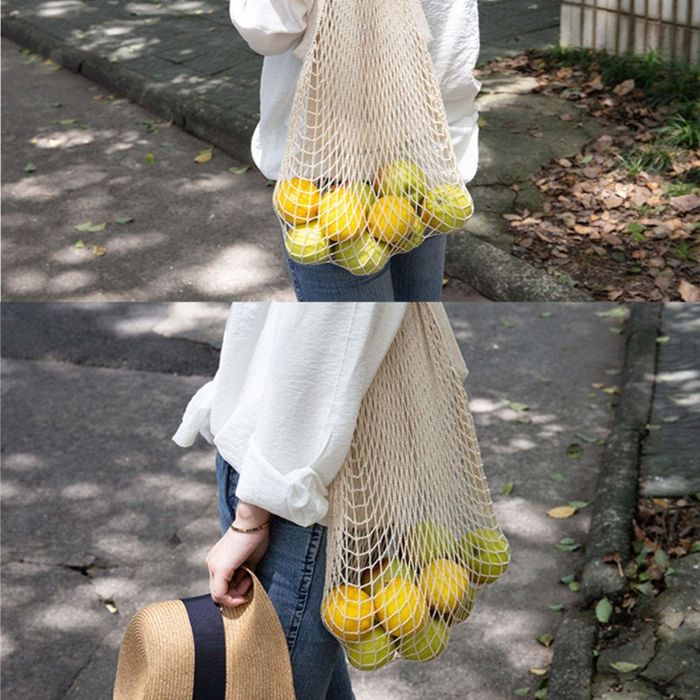 A close-up view of citrus fruits neatly packed inside a bag