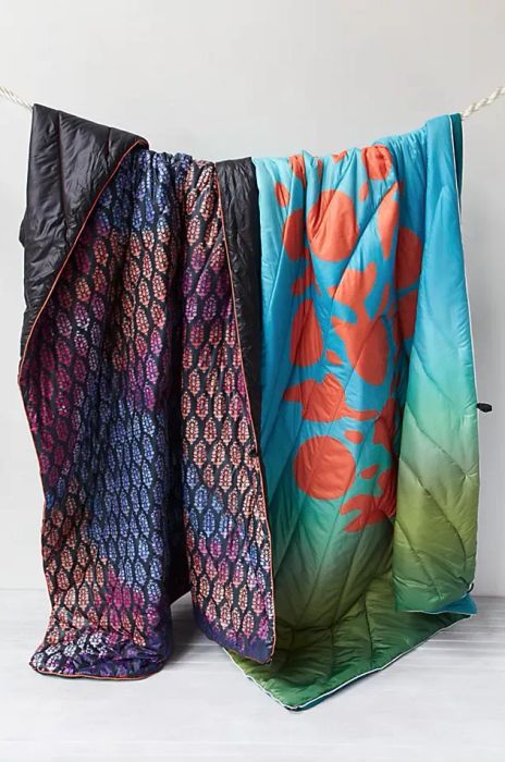 Two puffy blankets in vibrant patterns