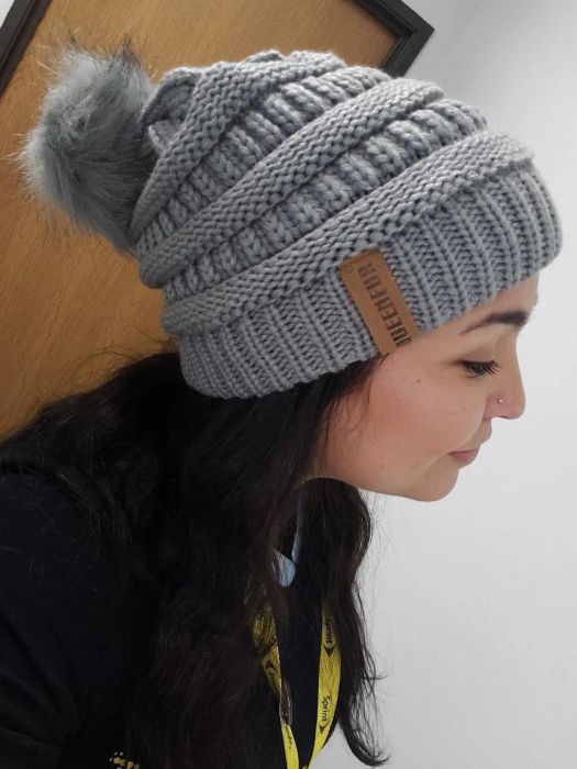 Reviewer wearing the all-gray version of the hat