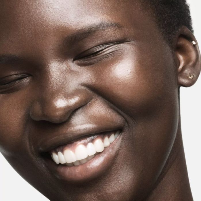 A close-up of a model after using the hydrating milk toner.