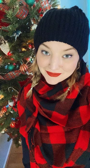 Reviewer’s selfie wearing the red and black scarf