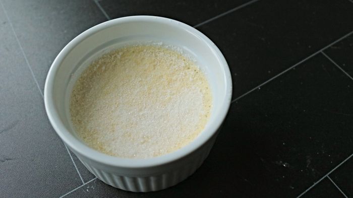 A crème brûlée topped with a layer of sugar.