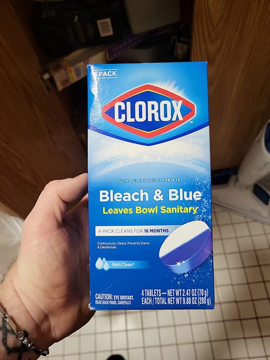 A reviewer proudly displaying their pack of Clorox toilet tabs.