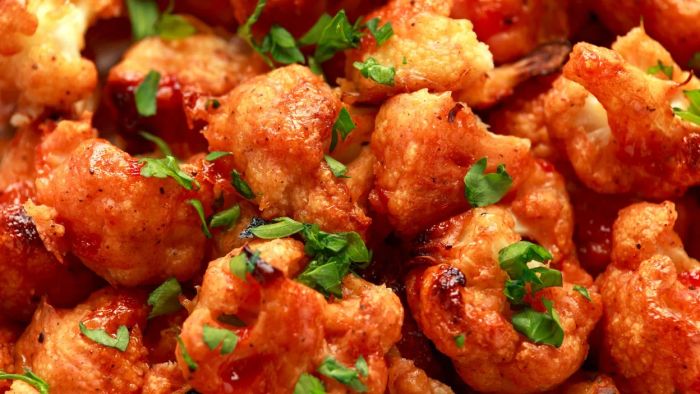 Close-up of crispy buffalo cauliflower bites.
