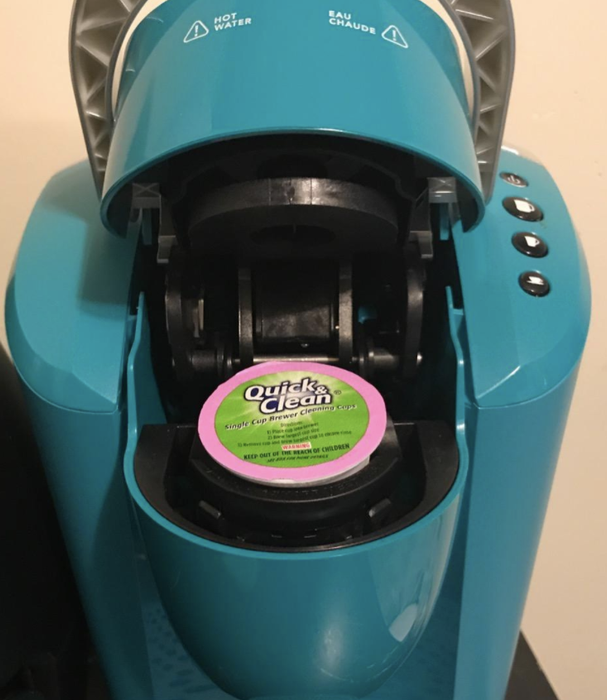 photo of a K-cup cleaning pod inside a Keurig machine