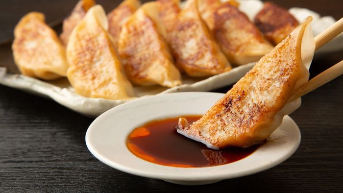Dipping dumplings in soy sauce is a classic practice.