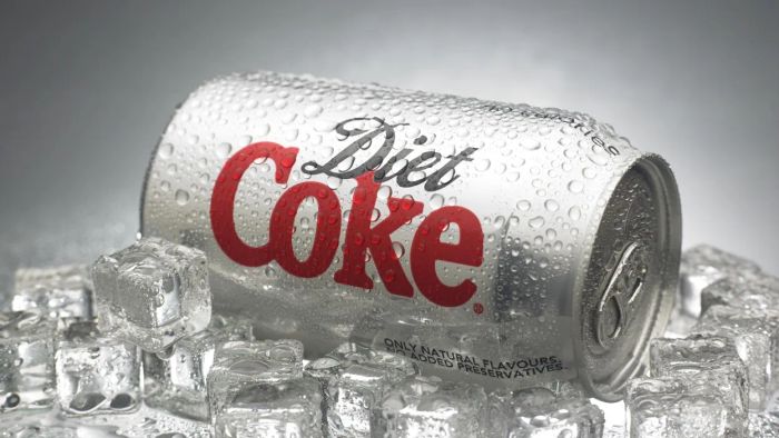 A can of Diet Coke perched on a bed of ice.