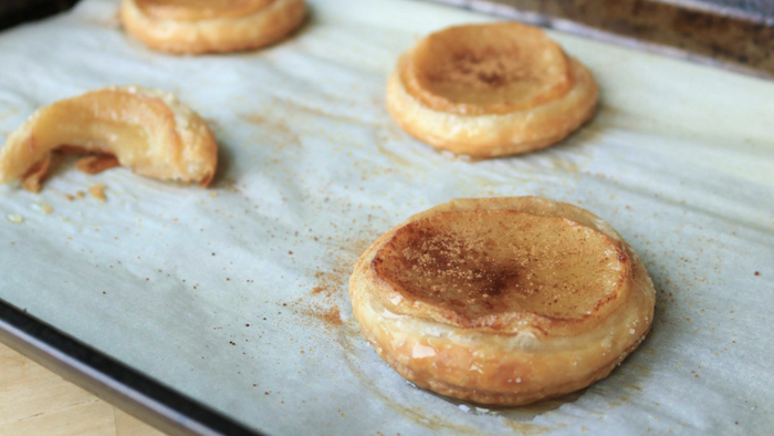 A tray of round apple pastries