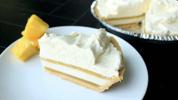 A serving of pineapple coconut pie on a plate.