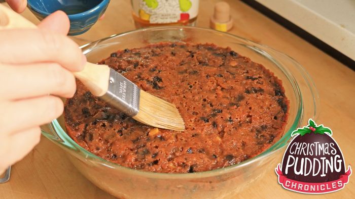 Use a pastry brush to gently apply a coating to the top of the cake.