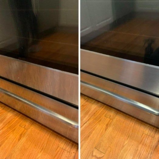 A reviewer demonstrating the results of using a stainless steel cleaner to restore the shine of a stainless steel oven, showcasing a before-and-after comparison.