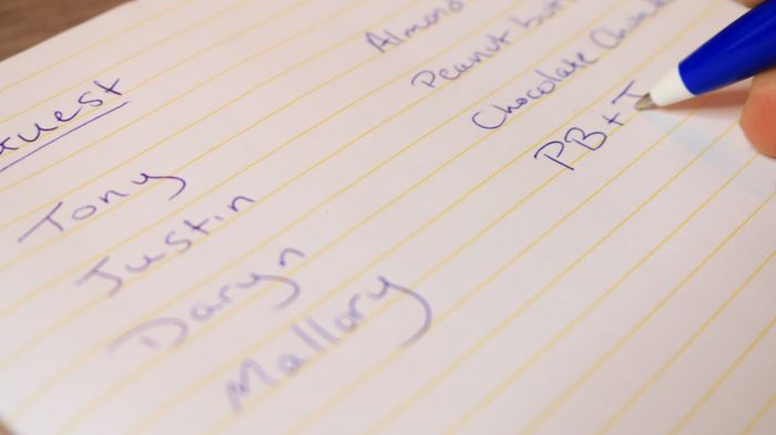 A pen jotting down notes in a notebook.
