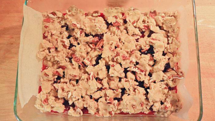 Sprinkle the crumbled topping over the jam bars.