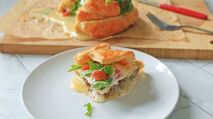 A serving of Crunchwrap Supreme-inspired brie en croûte.