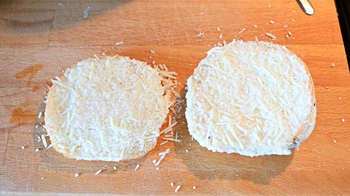 Bread topped with shredded cheese
