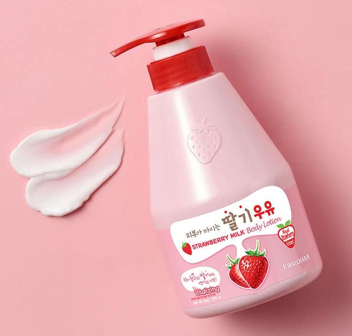 A bottle of Strawberry Milk Body Lotion with a pump dispenser, shown alongside lotion swipes. The packaging features a strawberry image and Korean text