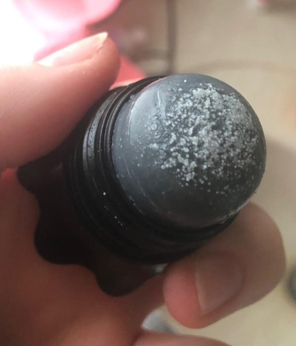 The cap is removed to reveal the salt topping of the remover