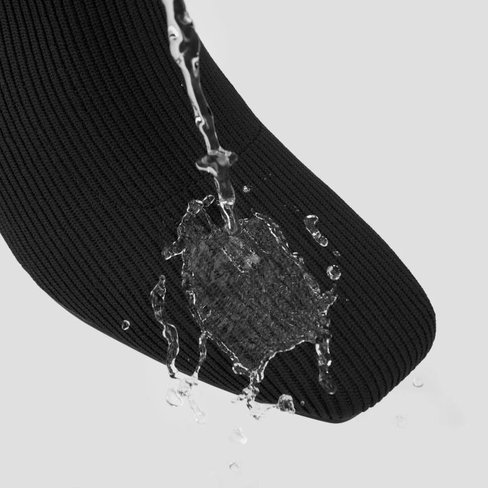 Water being poured over the boot to demonstrate its waterproof feature