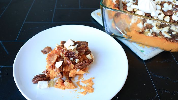 A serving of sweet potato casserole presented on a plate.