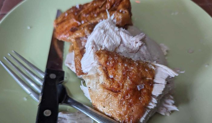 A slice of turkey on a fork.