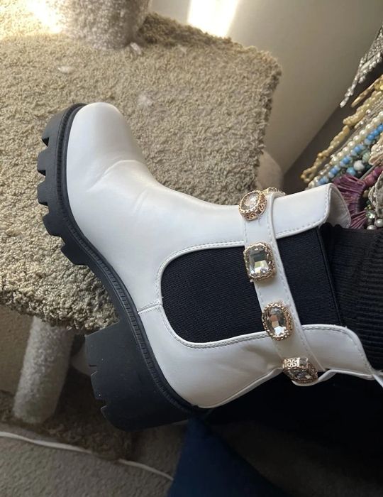 The same reviewer proudly displaying the boots