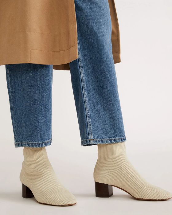 A model showcasing the boots in white