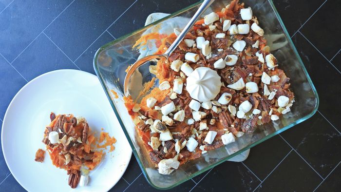 A sweet potato casserole displayed on a table.