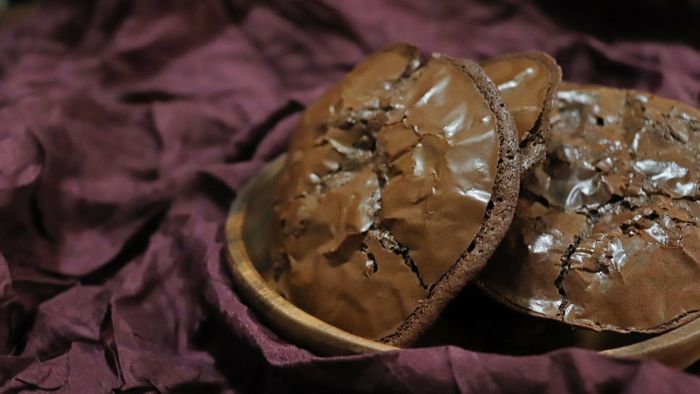 A plate filled with flourless chocolate cookies.