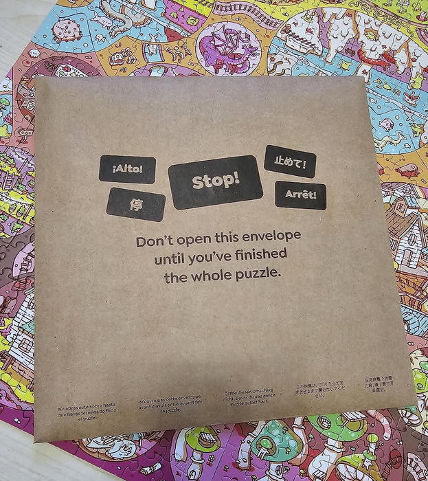 A bag marked with a note that reads 'Don't open this envelope until you've completed the puzzle.'