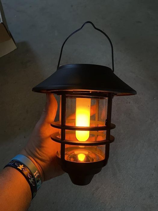 The reviewer proudly holds up the lantern