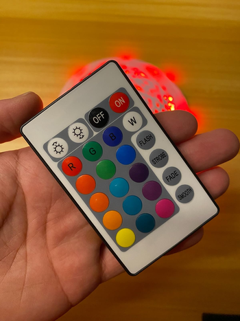 reviewer holding the control remote