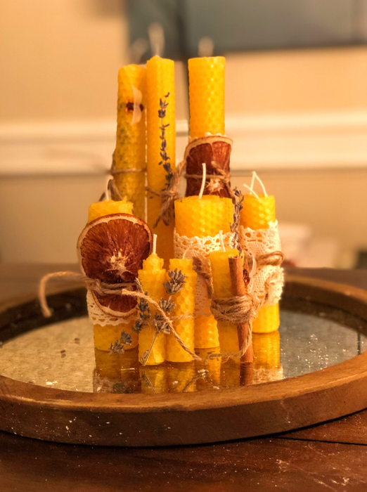 Candles adorned with dried oranges and lace from the reviewer