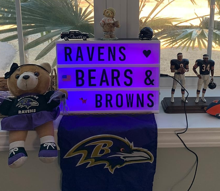 a purple light box sign featuring the words 'raven bears browns'