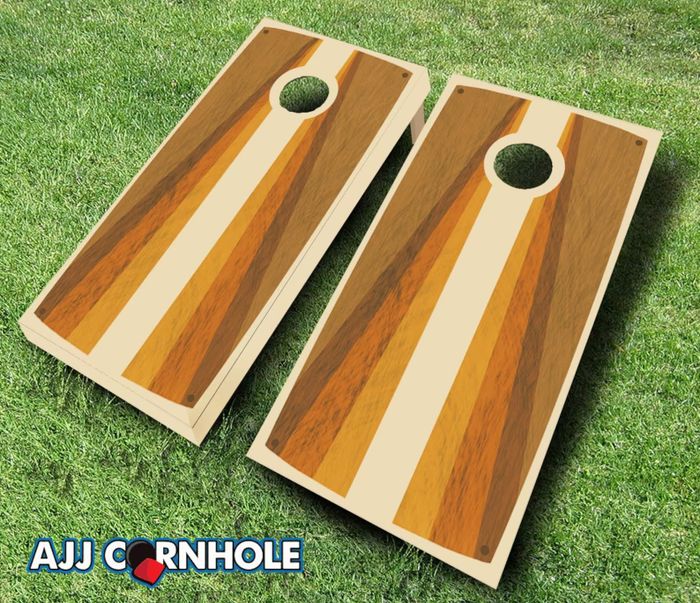 Two matching retro wooden cornhole sets, brightly painted and placed on a grassy field, ready for action.