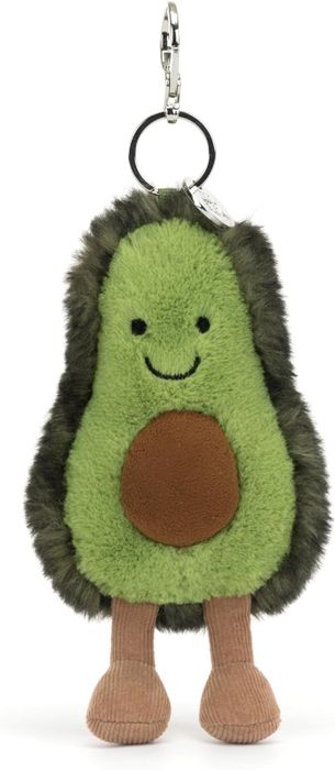 A plush avocado keychain with a smiling face, a brown seed, and corduroy legs, perfect as a gift or a personal accessory.