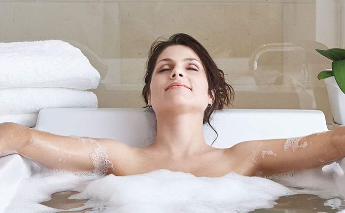 A model enjoying a relaxing bath soak experience.