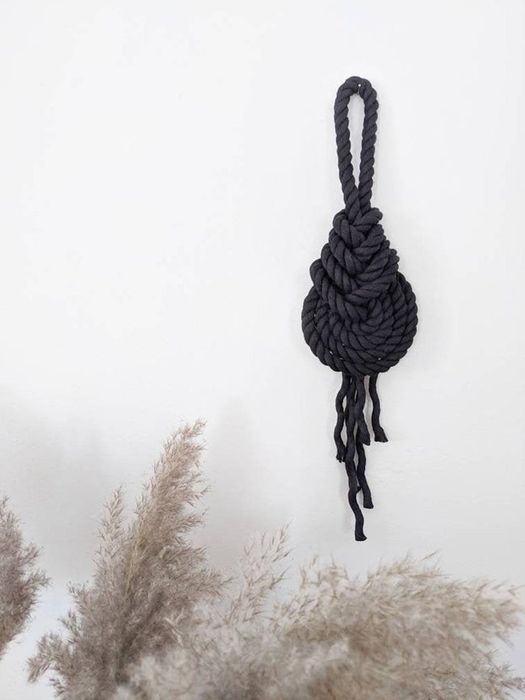 A black robe with large nautical knot designs